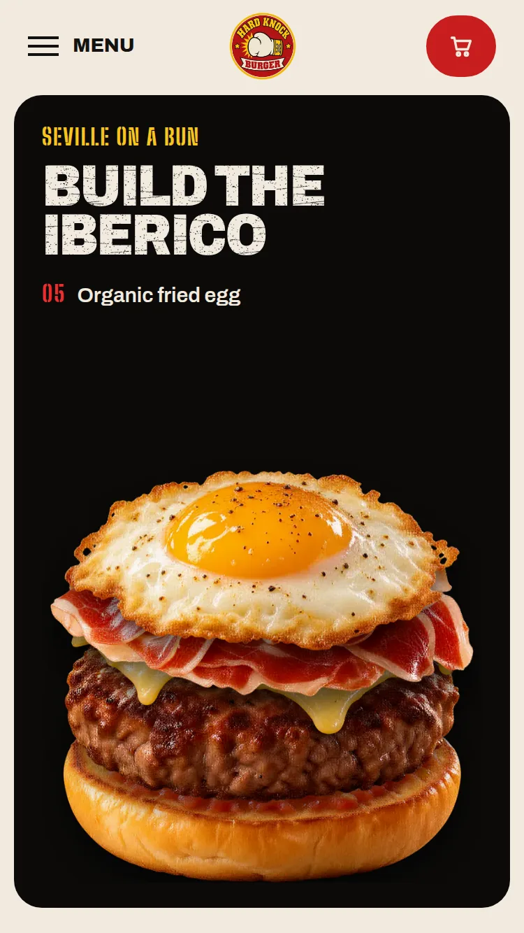 An organic fried egg lands on Iberico ham and melted Manchego